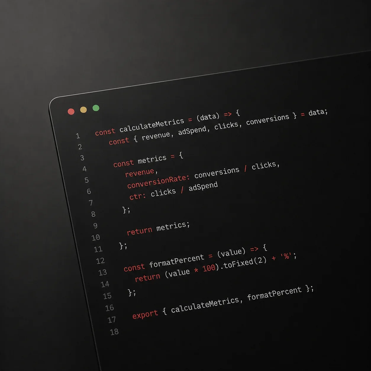 Angled view of a laptop screen showing JavaScript code with syntax highlighting