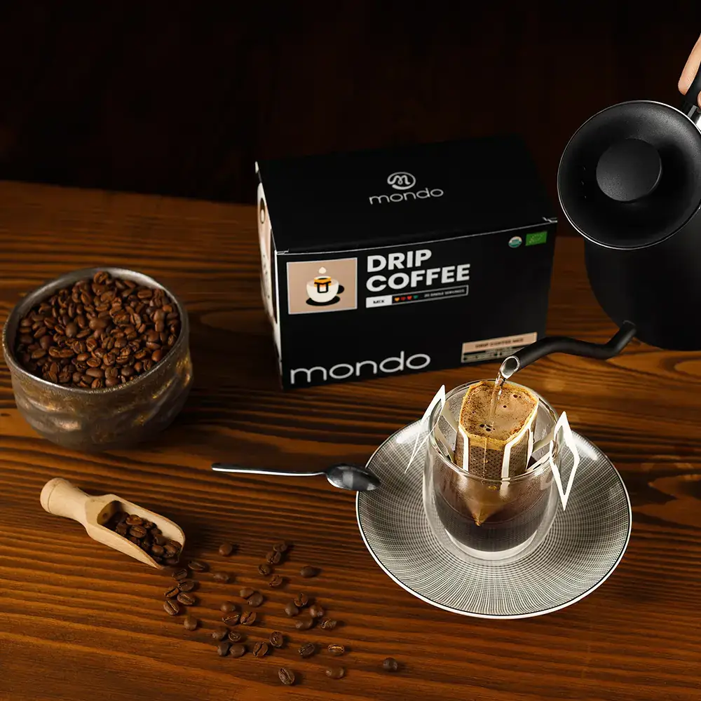 Mondo drip coffee styled on a countertop with brewing equipment